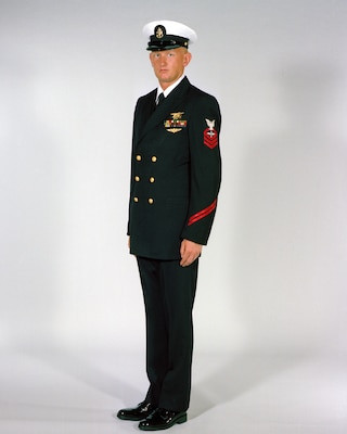 Chief petty officers in men’s service dress blue uniforms in 1984, highlighting the gold buttons distinguishing them from navy enlisted uniforms of lower grades.