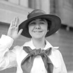 Loretta Perfectus Walsh, the first woman to enlist in the U.S. Navy, signing her enlistment papers in 1917, wearing what would become an early female navy officer uniform