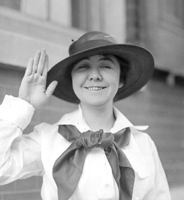 Loretta Perfectus Walsh, the first woman to enlist in the U.S. Navy, signing her enlistment papers in 1917, wearing what would become an early female navy officer uniform