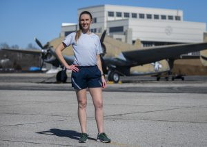 Air Force 1st Lt. Avery Thompson demonstrates the new PT uniform t-shirt and running shorts at Wright-Patterson Air Force Base, Ohio, in February 2021, highlighting the athletic fit and design.