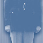 Officer in "Pinks and Greens" U.S. Army Air Corps uniform, showcasing gold insignia and flight cap piping.