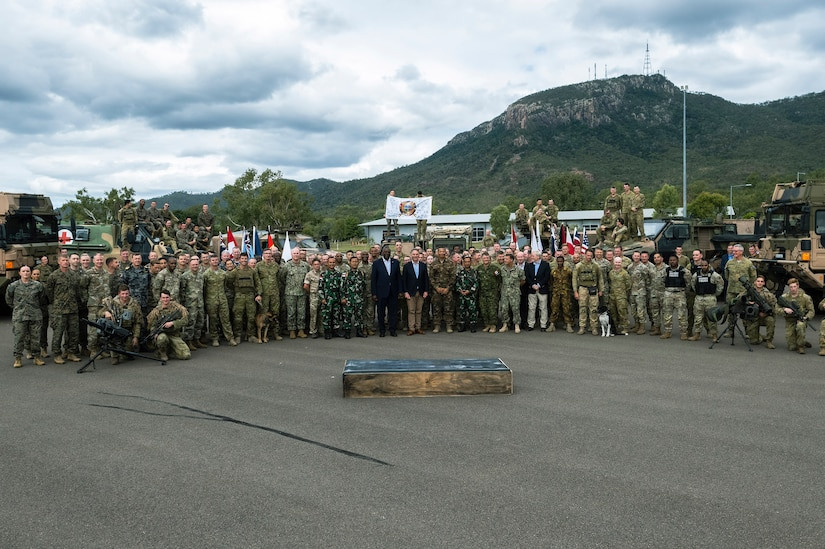 Multinational troops including Australian Defence Force personnel pose for a group photo at Exercise Talisman Sabre.