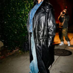 Rihanna showcases a modern cowboy uniform in Los Angeles, featuring a denim jacket and baggy jeans.