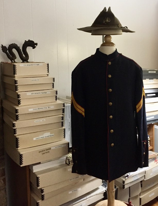 Detailed shot of the undress service coat fabric and buttons, highlighting the material and construction of early military garments.