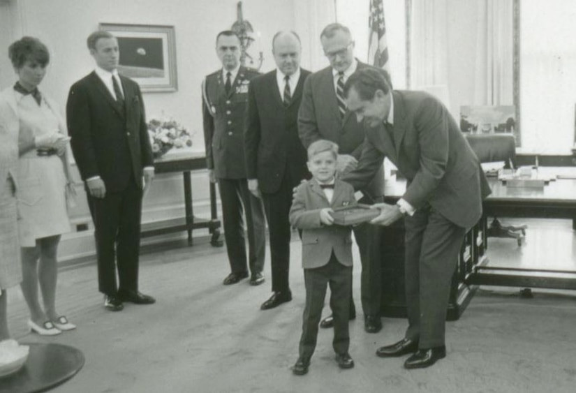 President Nixon presenting the Medal of Honor to Hosking's young son, a moment of national recognition.
