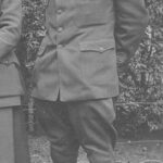 Lillian Baker Griggs in her World War I ALA camp librarian uniform, showcasing the sleeve patch and open-book pins.