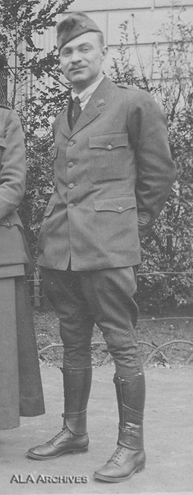 Lillian Baker Griggs in her World War I ALA camp librarian uniform, showcasing the sleeve patch and open-book pins.