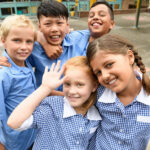 Students in school uniforms on elementary school playground