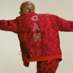 Damian Warner, Canadian Olympic athlete, showcases the Team Canada Opening Ceremony uniform designed by Lululemon for the Paris 2024 Olympics, featuring a printed jacket and pants.