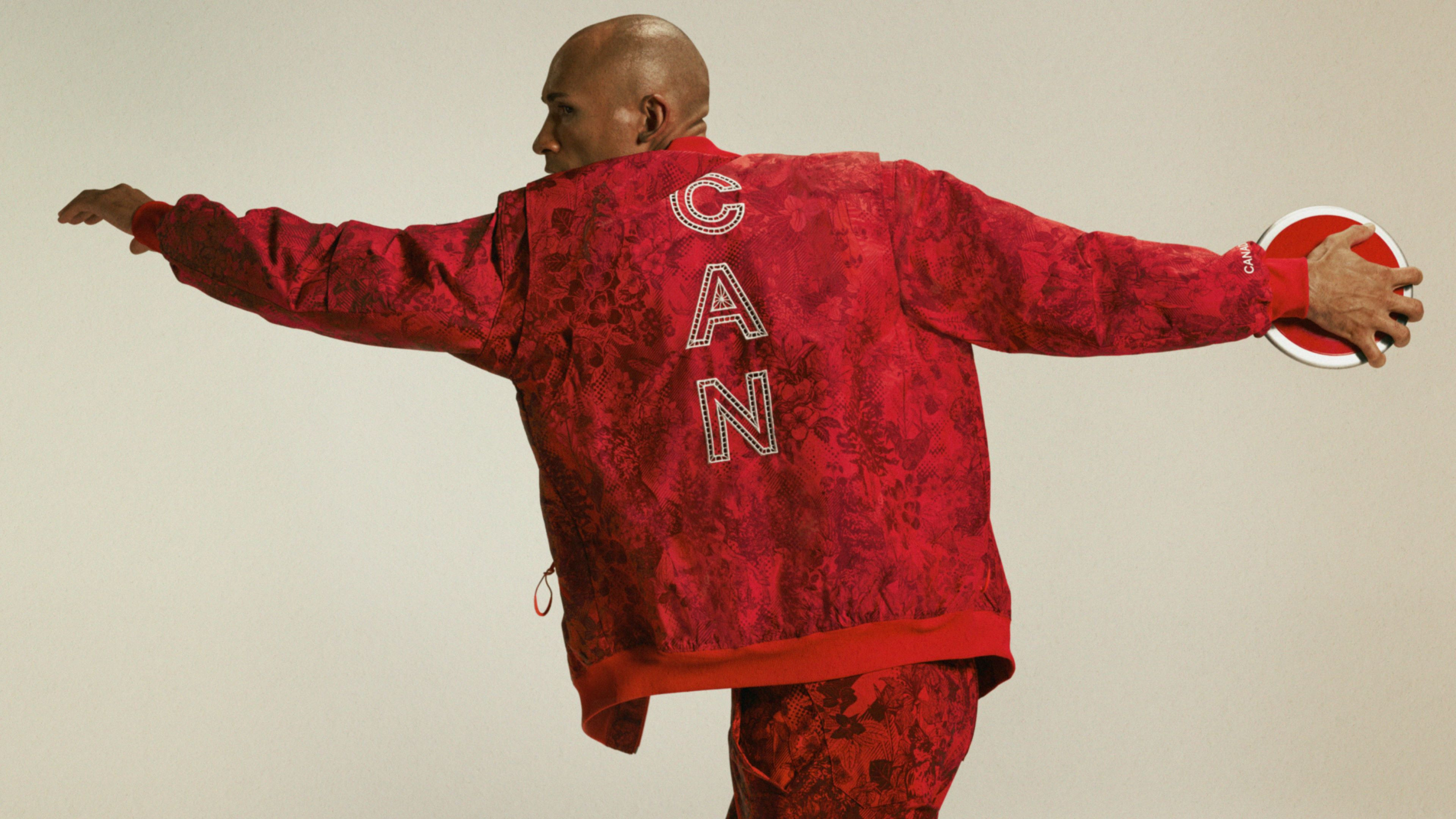 Damian Warner, Canadian Olympic athlete, showcases the Team Canada Opening Ceremony uniform designed by Lululemon for the Paris 2024 Olympics, featuring a printed jacket and pants.