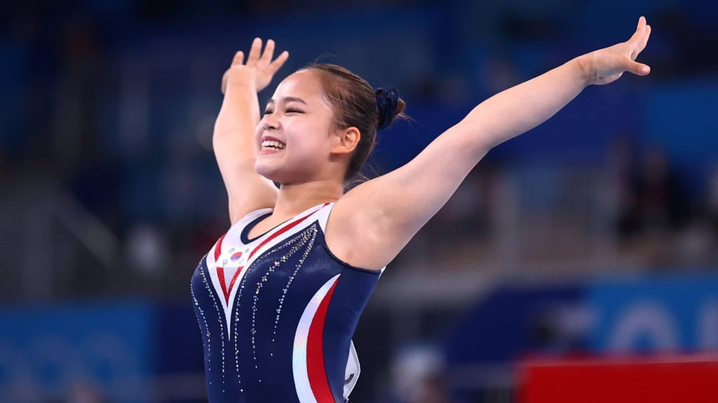 South Korean gymnast Yeo Seojeong performs vault at the Tokyo Olympics, showcasing the 'elegant design' requirement for women's gymnastics uniforms, a point of discussion regarding Olympic attire standards.