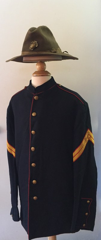 Close-up of an early 20th-century campaign hat showcasing star vent detail and chin strap.