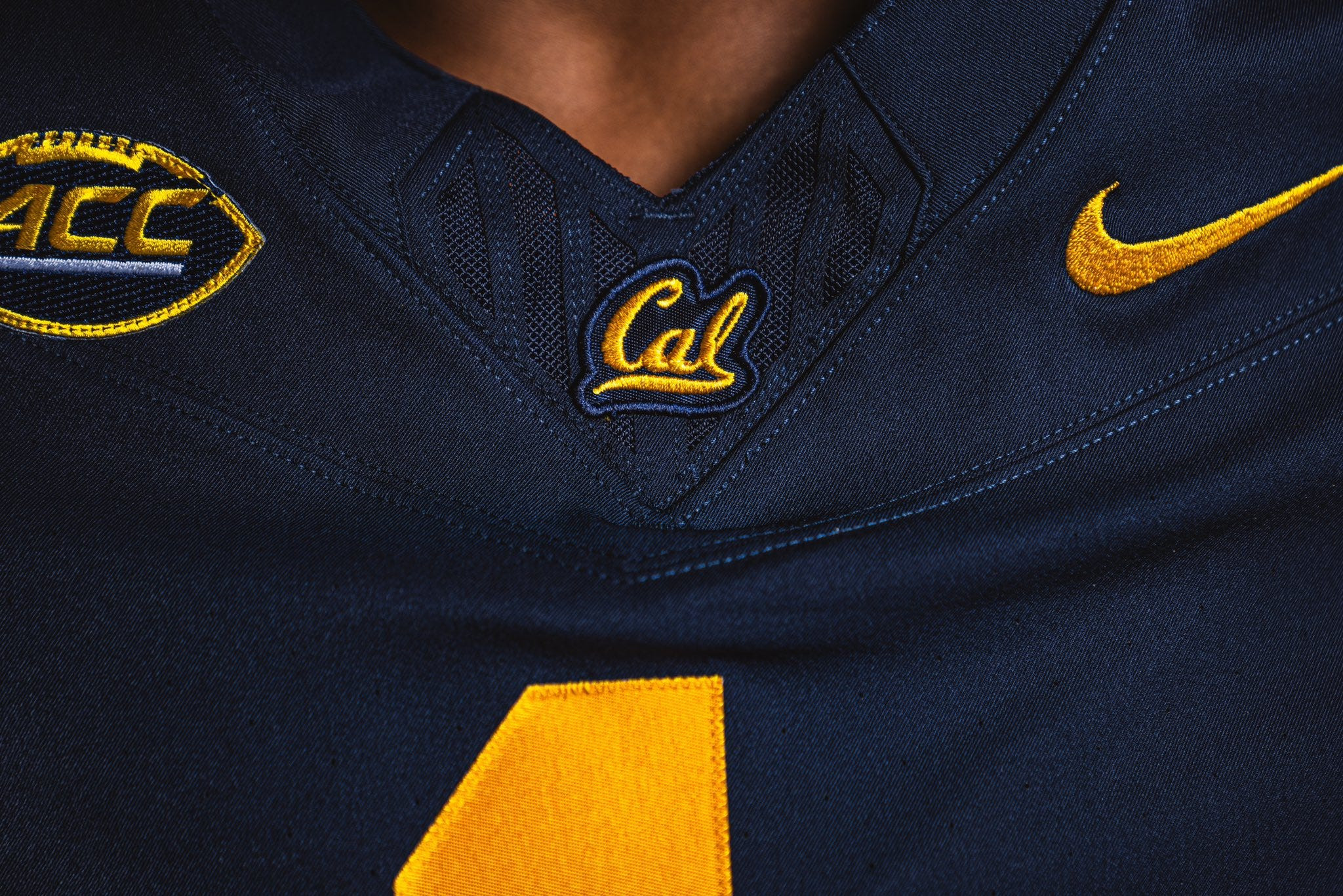 Detailed view of the ACC and embroidered Cal logos on the new football uniform, symbolizing the team's conference transition.