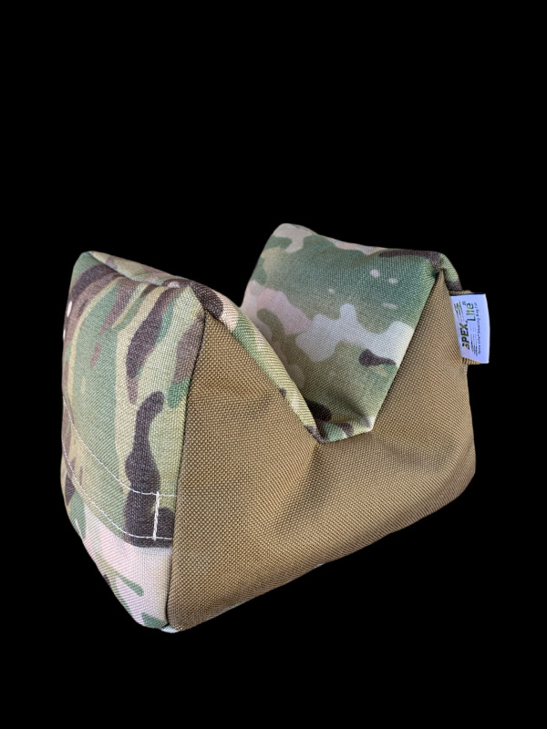 Action shot of a shooter using a Tango Uniform bag in a field environment.