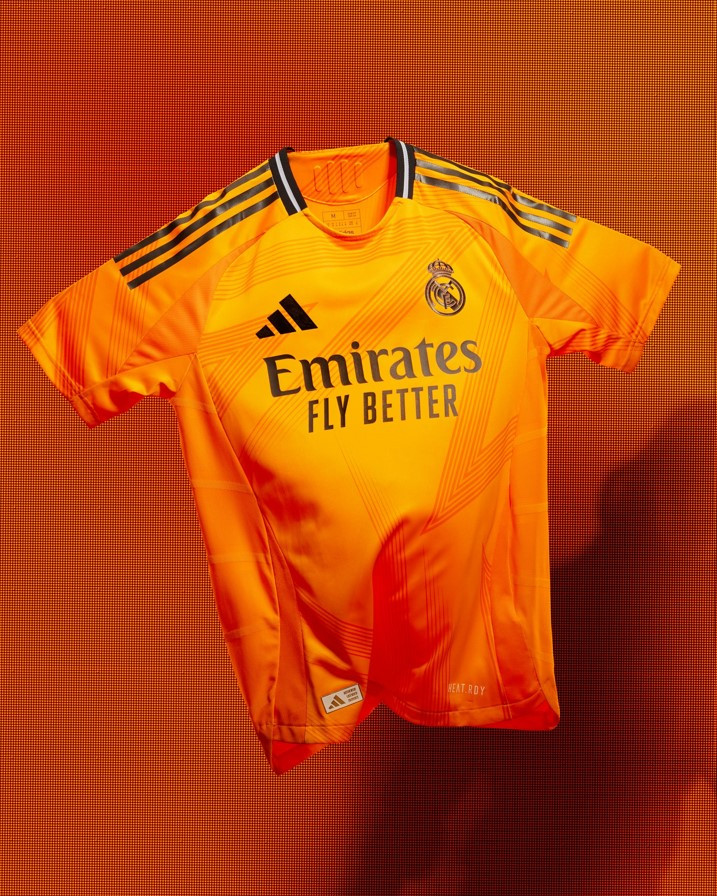 Real Madrid 2024-2025 Away Jersey: A light blue design by Adidas.