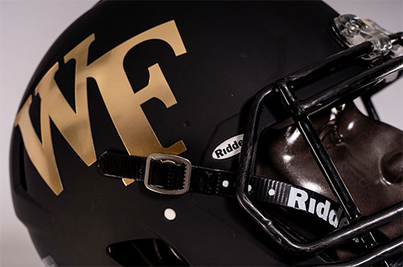 Wake Forest Demon Deacons football uniform presentation, showcasing the jerseys and helmets in a studio setting.