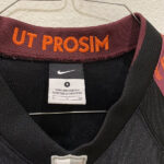 Close-up of the back of the Virginia Tech helmet showing "Ut Prosim" detail, part of the 2010 Nike Pro Combat uniform design.
