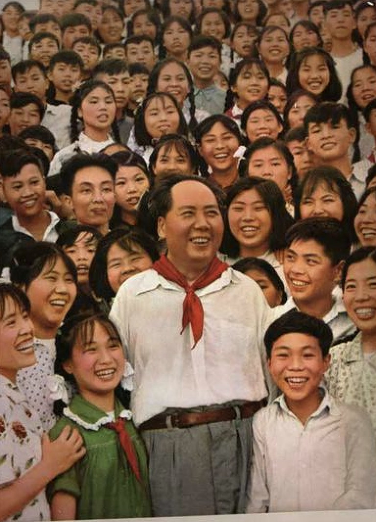 Students wearing white shirts and dark pants, representing the simplicity of school uniforms in the 1950s.