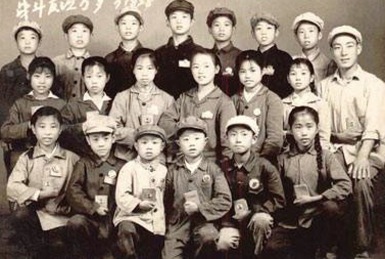 Students standing in line for a uniform check, symbolizing the enforcement of uniform policies in Chinese schools.