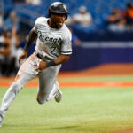 Tim Anderson of the Chicago White Sox rounding the bases in the classic road grey uniform