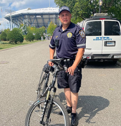 NYC cop in soft uniform with embroidered markings