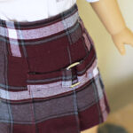 Plaid doll skirt with neat pleats and a secure waistband