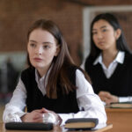Students in school uniforms standing together